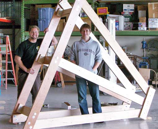 Students standing inside trebuchet base